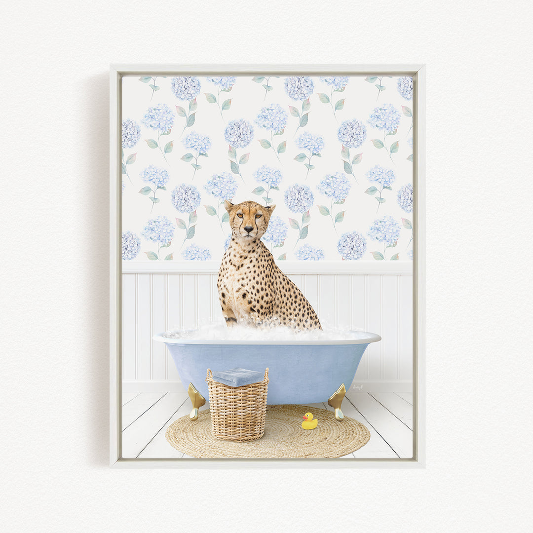 A cheetah sitting in a blue bathtub filled with water, surrounded by a wicker basket and a yellow rubber duck.