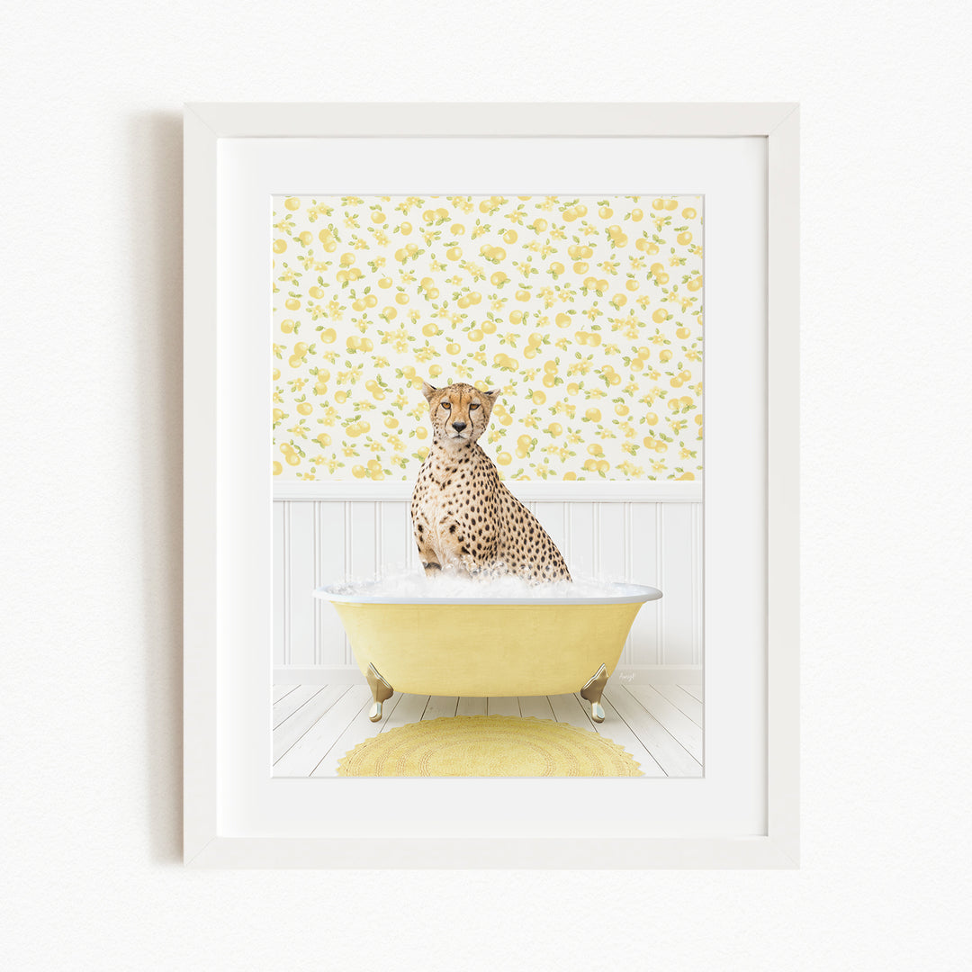 A cheetah sitting in a yellow bathtub filled with water, surrounded by a yellow floral wallpaper.