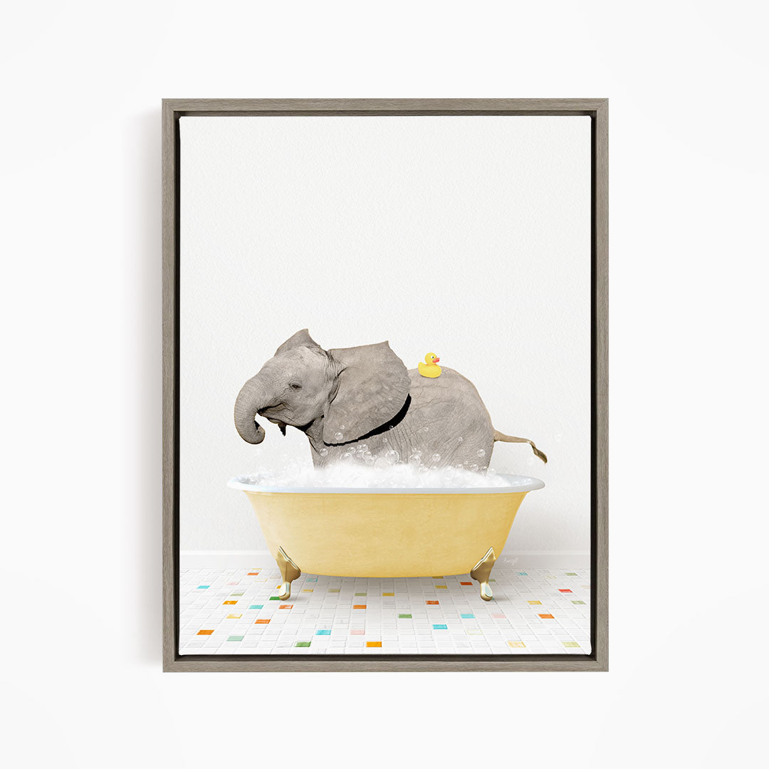 A gray elephant is sitting in a yellow bathtub filled with water, with a yellow rubber duck floating on its back.