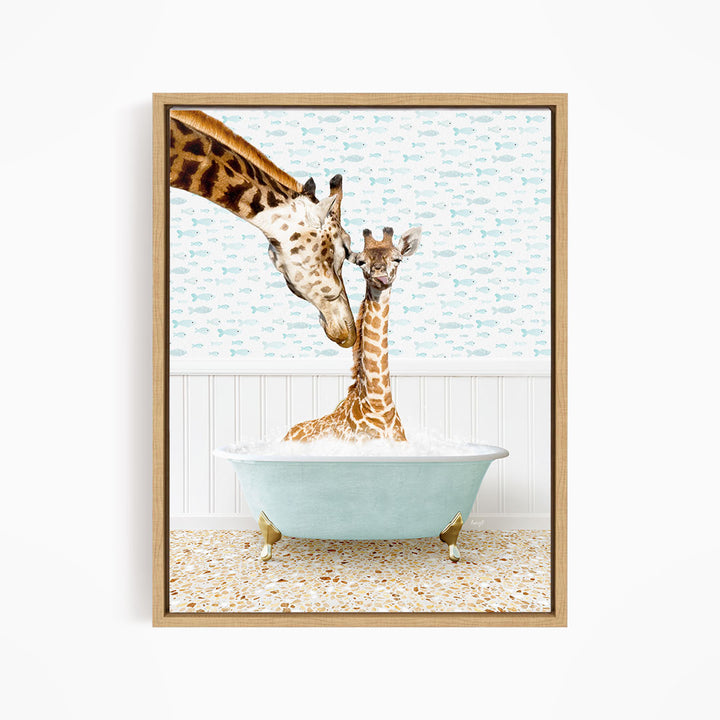 A mother giraffe and her baby giraffe are sitting together in a light blue bathtub, with the mother gently licking her baby.
