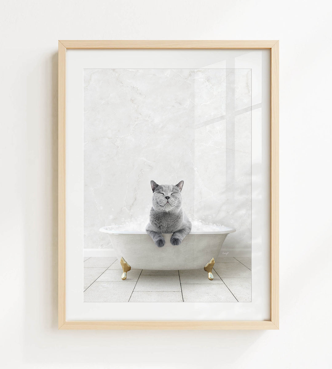 A gray cat sitting in a white bathtub, with its eyes closed, appears to be enjoying a relaxing bath.