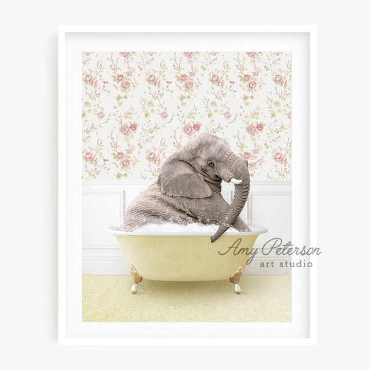 a baby elephant sitting in a bath tub