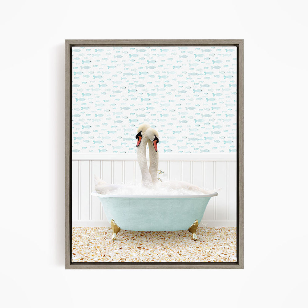 A white swan is sitting in a light blue bathtub filled with bubbles, with a patterned wall behind it.