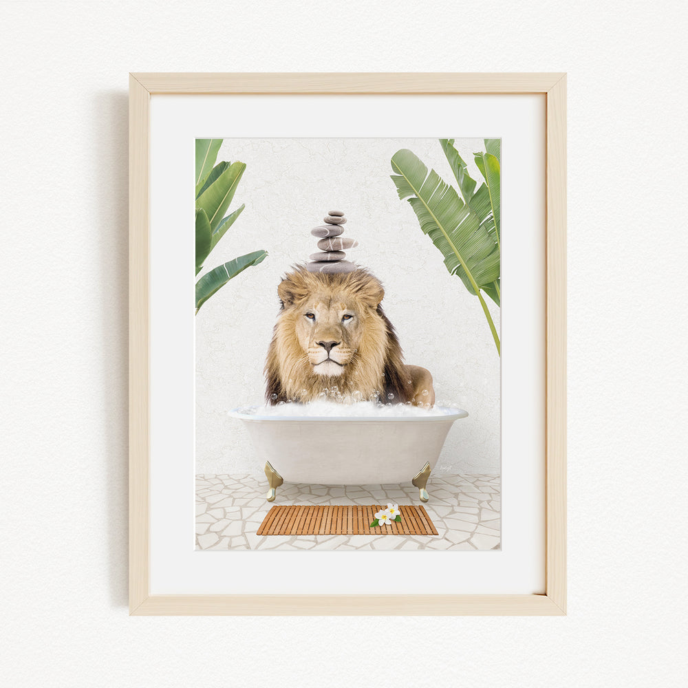 A framed image depicting a lion sitting in a bathtub filled with water, surrounded by tropical plants.