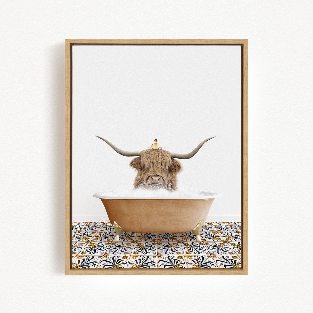 A Highland cow with large horns is sitting in a bathtub filled with bubbles, with a small bird perched on its head.