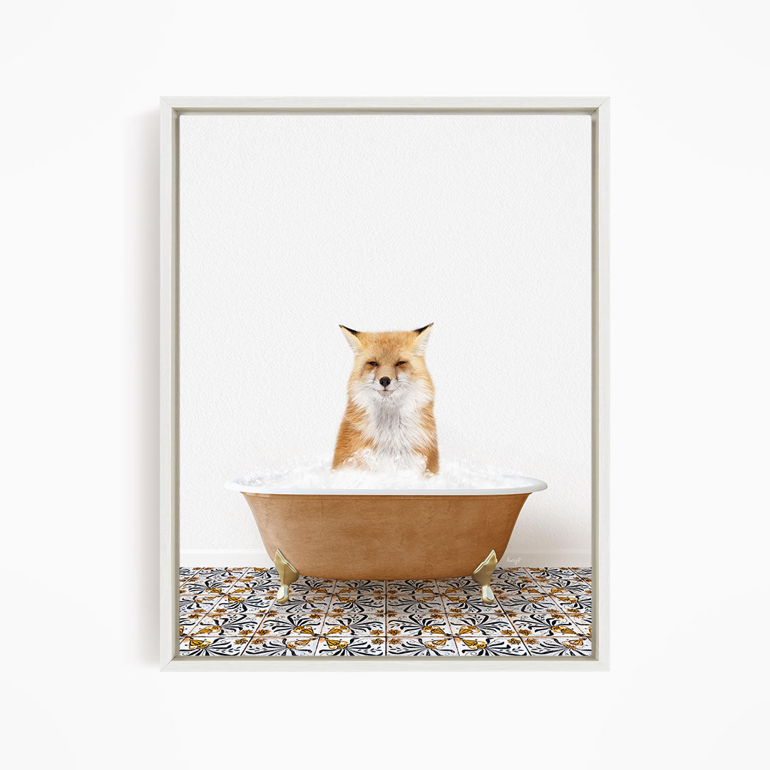 A red fox sitting in a bathtub filled with bubbles, looking relaxed and content.