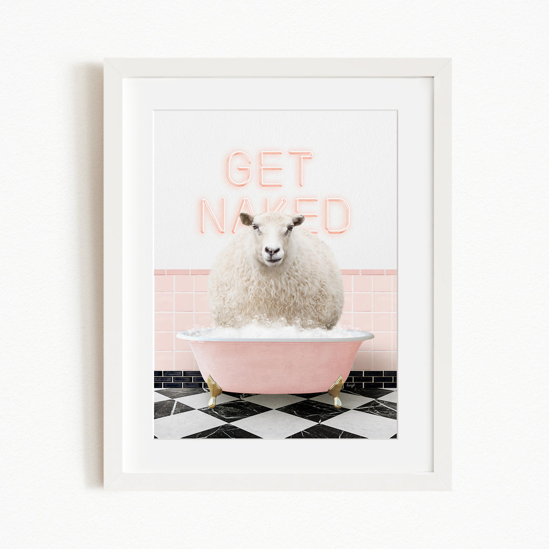 A white sheep sitting in a pink bathtub with the words "GET NAKED" written on the wall behind it.