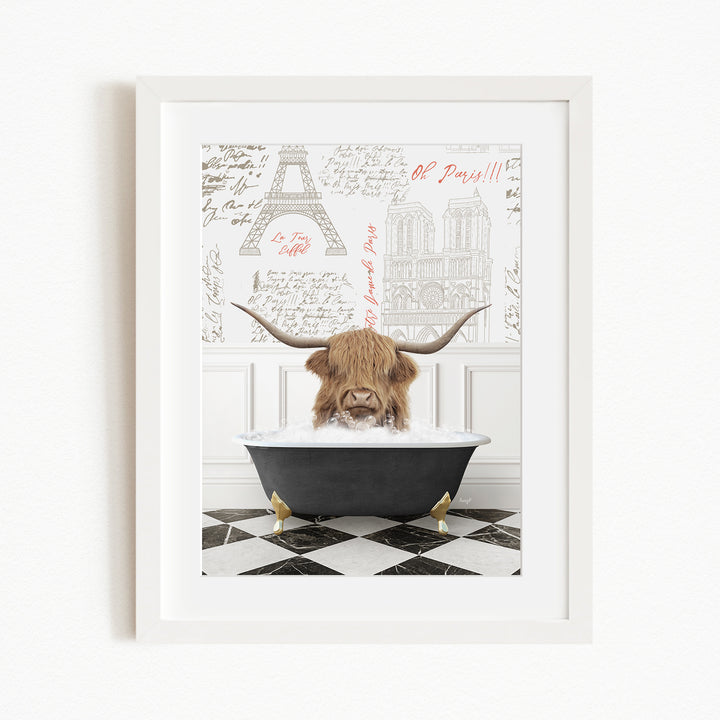A framed image depicting a large horned animal, possibly a yak or a yak dog, sitting in a bathtub filled with water, with a Paris-themed background behind it.