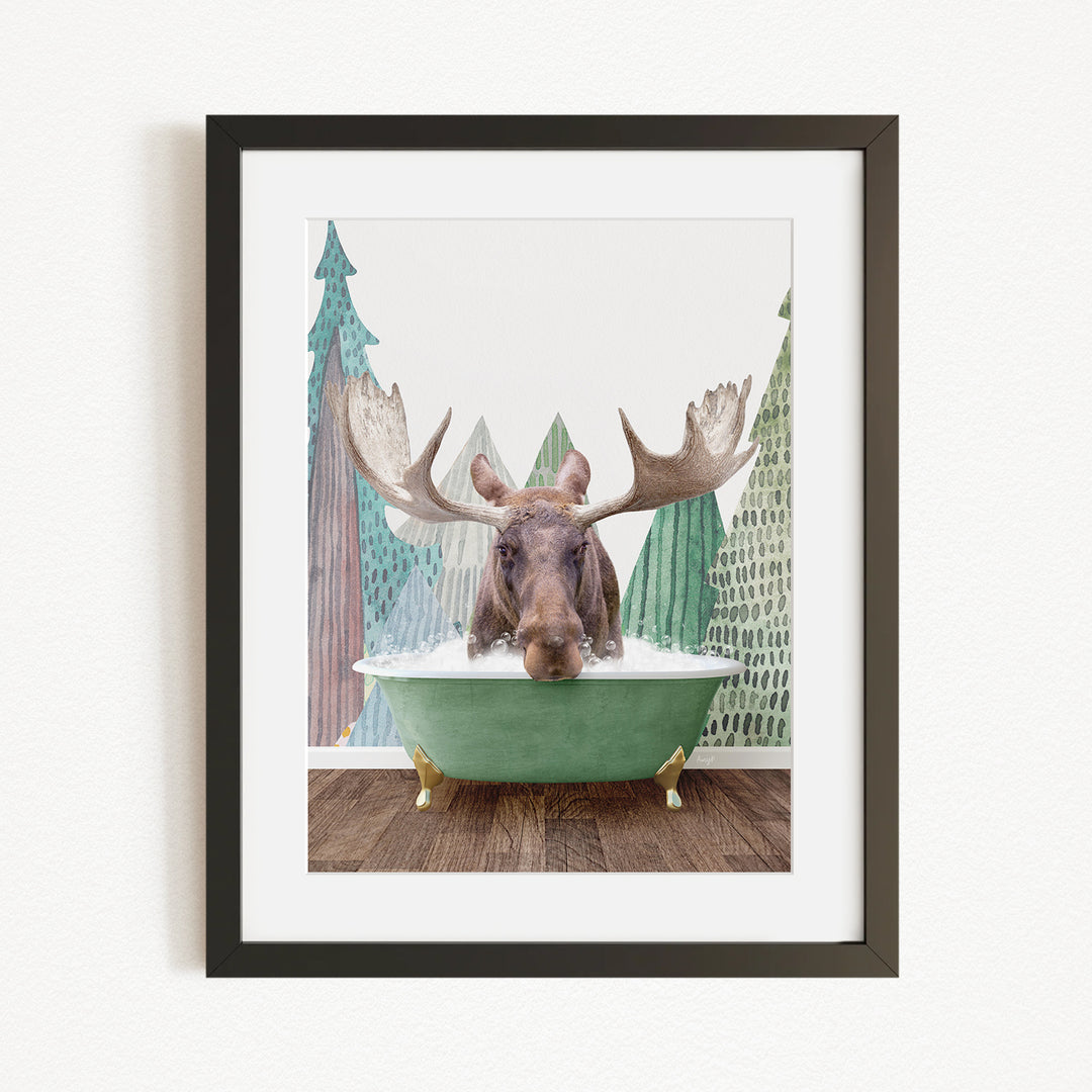 A moose with large antlers is sitting in a green bathtub, surrounded by a forest scene with trees and a snowy landscape.