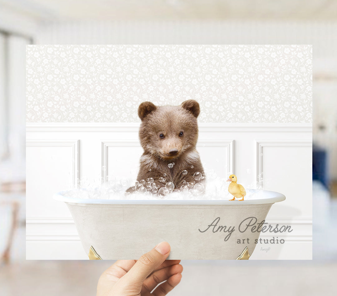 a person holding a picture of a teddy bear in a bathtub