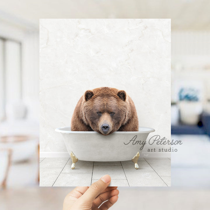 a brown bear sitting in a bath tub