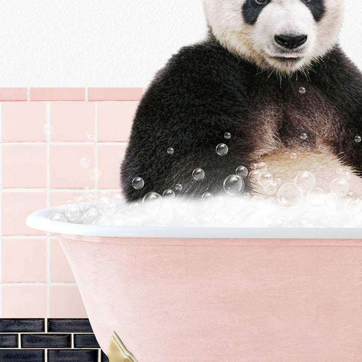 a panda bear sitting in a bathtub full of bubbles