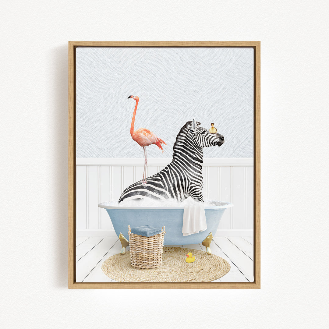 A zebra is sitting in a blue bathtub, surrounded by a pink flamingo, a yellow rubber duck, and a basket.