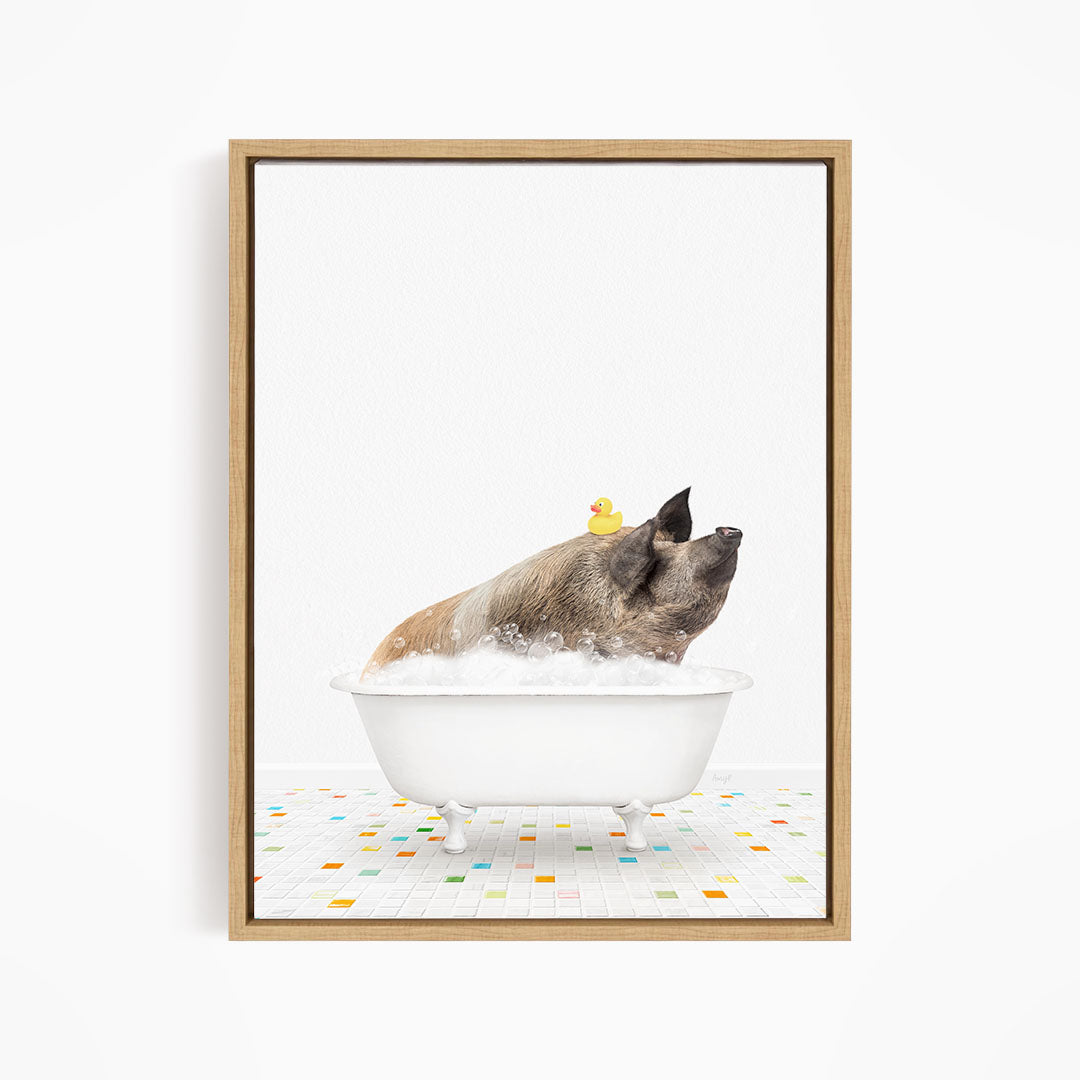 A pig sitting in a white bathtub filled with bubbles, with a rubber duck floating on top.