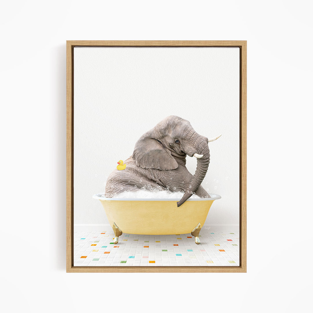 A gray elephant is sitting in a yellow bathtub, with a yellow rubber duck floating on its back.