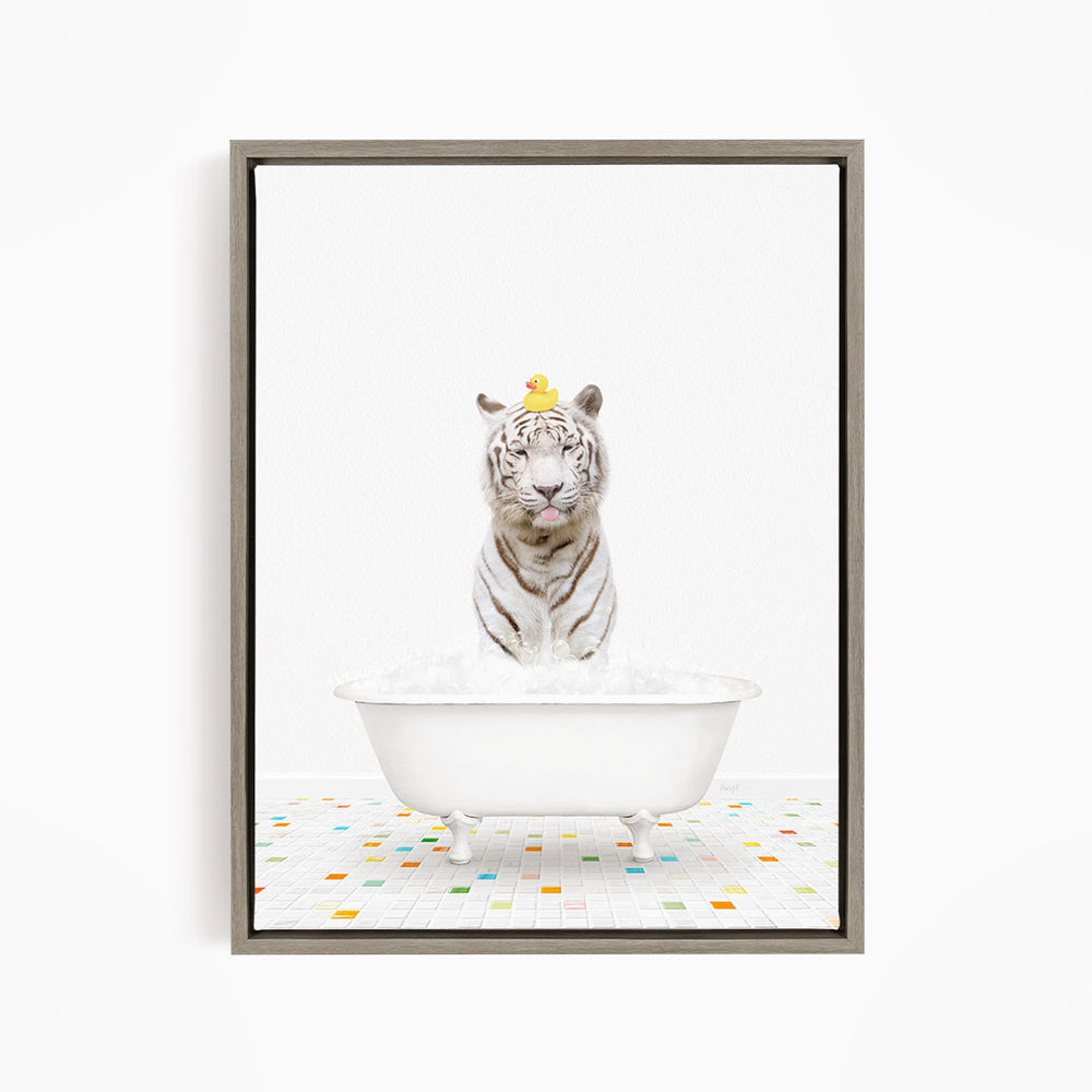 A white tiger is sitting in a white bathtub filled with water, with a yellow rubber duck perched on its head.