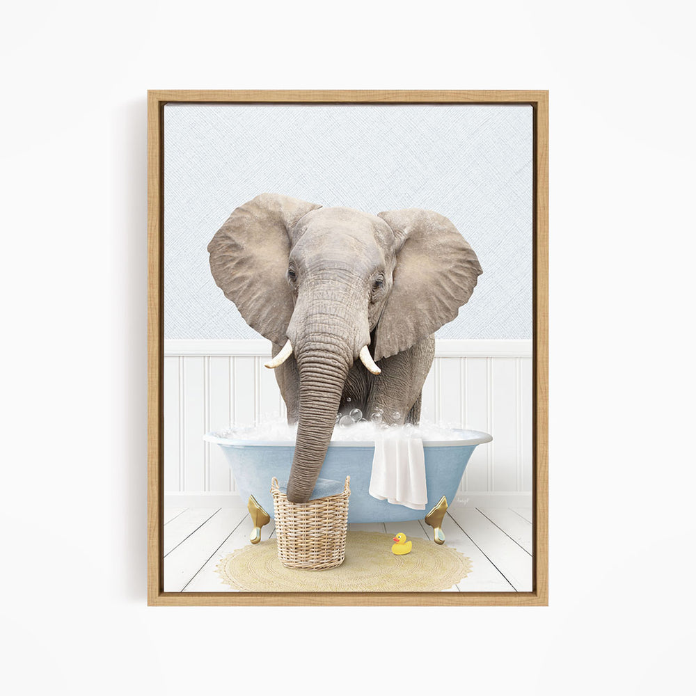 A gray elephant is standing in a blue bathtub filled with water, surrounded by a yellow rubber duck and a basket.