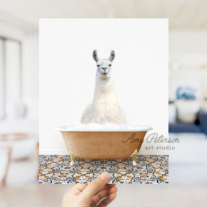 a llama in a bathtub with a hand holding a card