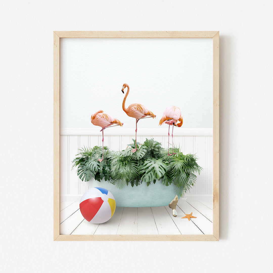 a group of flamingos in a bathtub with a beach ball