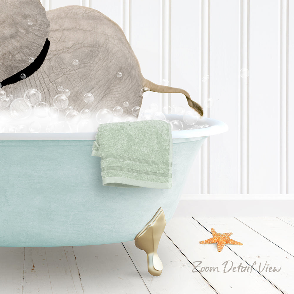 A light blue bathtub filled with bubbles, with a towel and a starfish placed inside.