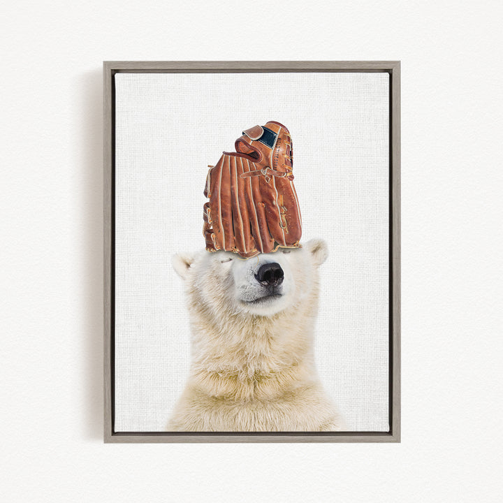 A polar bear wearing a baseball glove on its head, with the glove appearing to be made of brown leather.
