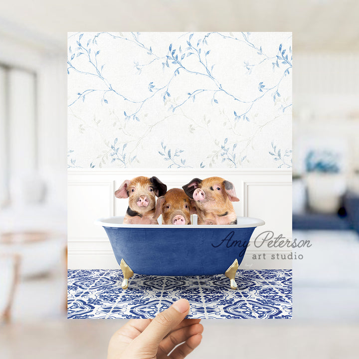 a person holding a card with three dogs in a bathtub