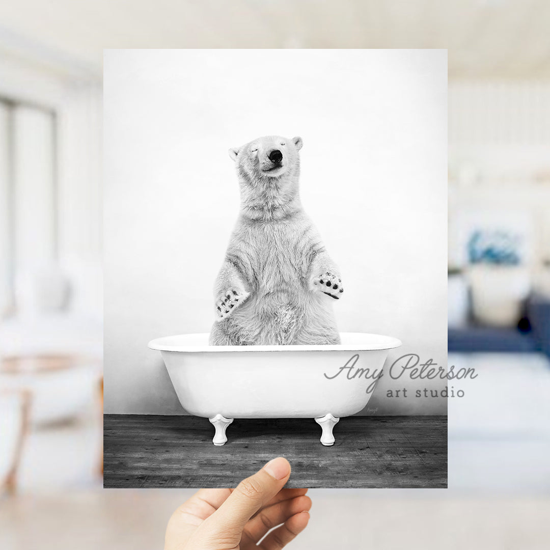 a person holding up a polar bear in a bathtub