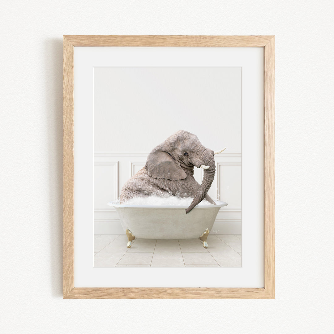 A gray elephant is sitting in a white bathtub filled with water, creating a whimsical and playful scene.