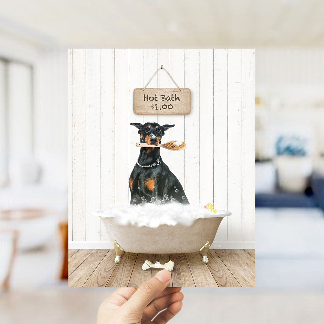 A black and brown dog is sitting in a bathtub filled with bubbles, holding a toy in its mouth.
