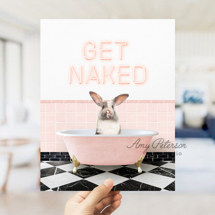 a person holding up a card with a picture of a bunny in a bathtub