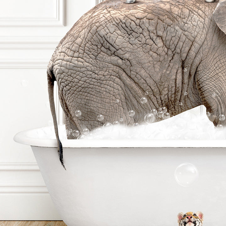 an elephant is taking a bath in a bathtub