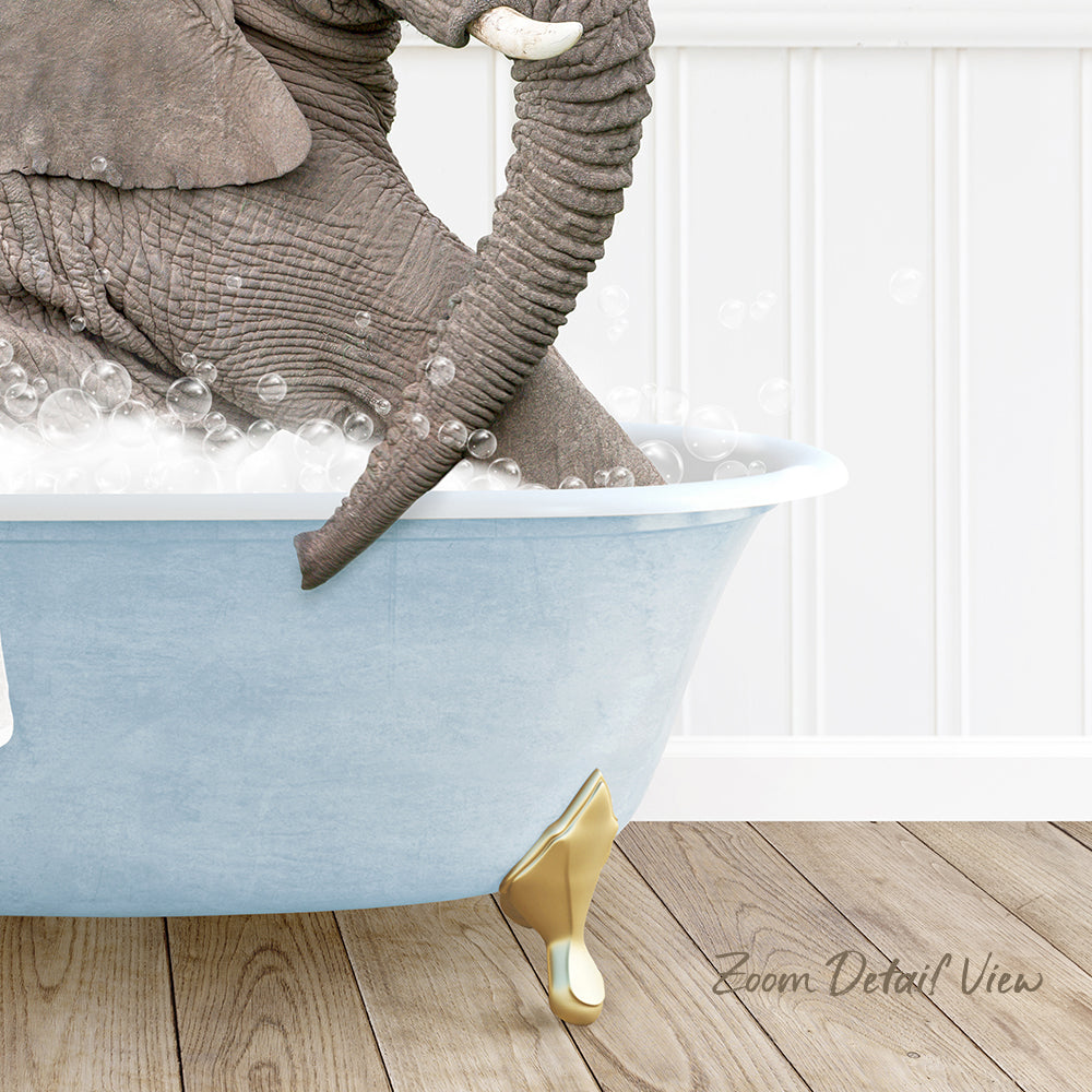 A large elephant is sitting in a blue bathtub filled with bubbles, with its trunk submerged in the water.