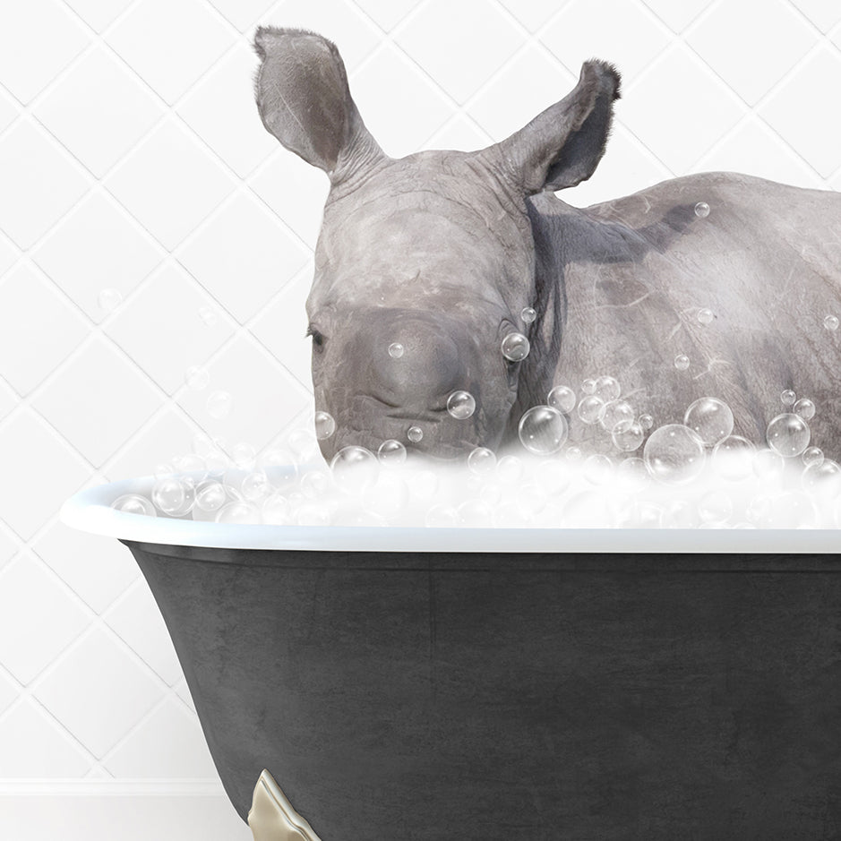 a rhino is taking a bath in a bathtub