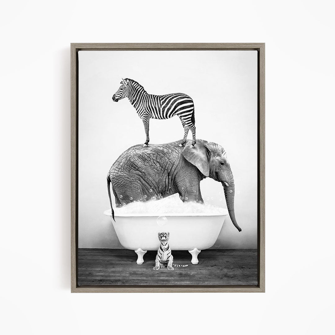 A zebra stands on top of an elephant in a bathtub, with a small tiger sitting in the tub below.