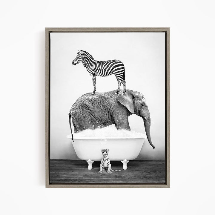 A zebra stands on top of an elephant in a bathtub, with a small tiger sitting in the tub below.