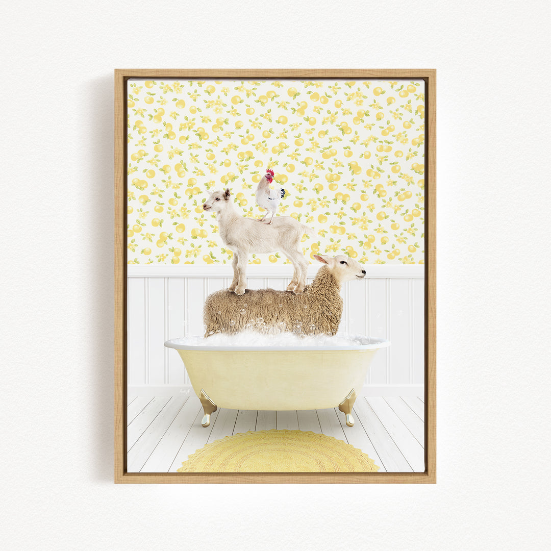 A framed image depicting a white sheep standing on a yellow bathtub, with a rooster perched on top of the sheep.