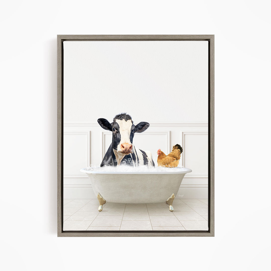 A black and white cow is sitting in a white bathtub, with a chicken standing nearby, in a white-walled room.