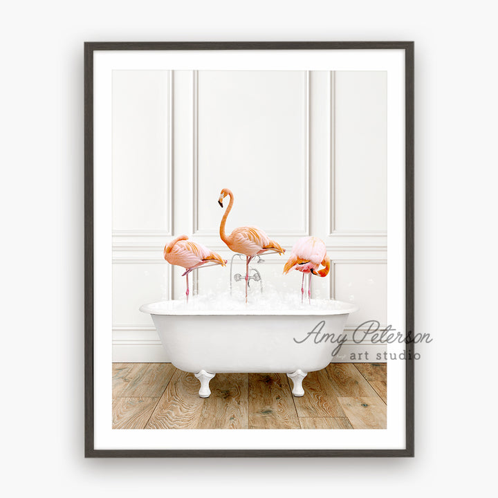 three flamingos in a bathtub with ice