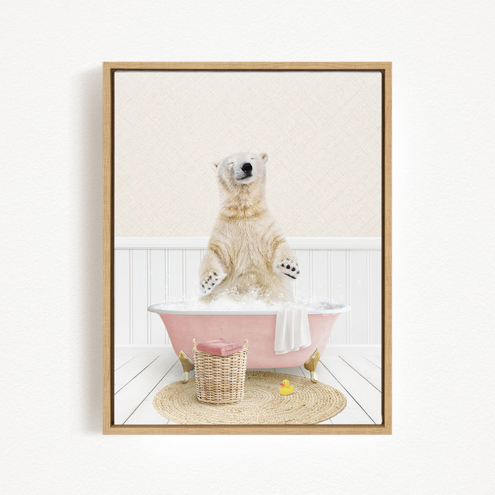 A polar bear standing in a pink bathtub filled with bubbles, surrounded by a wicker basket and a yellow rubber duck.