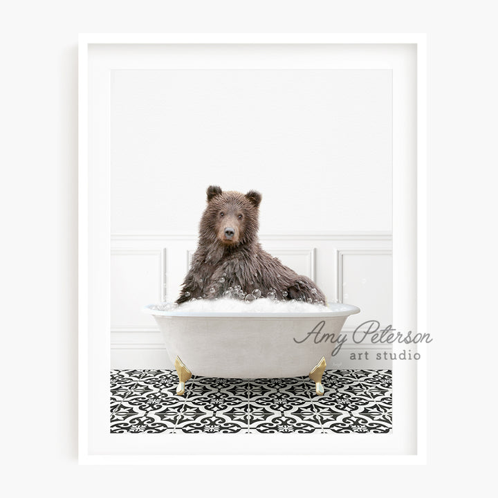 a brown bear sitting in a bath tub