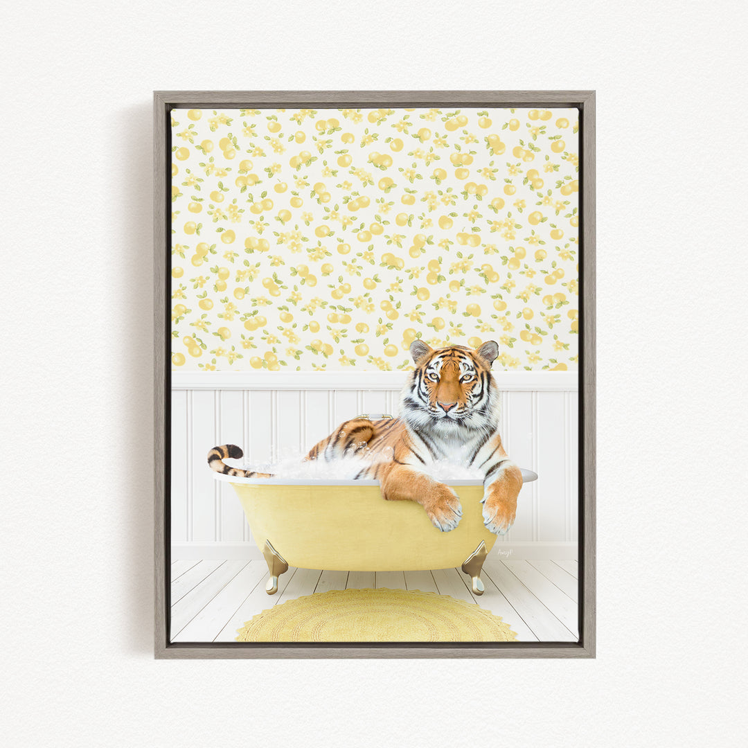 A tiger is sitting in a yellow bathtub, surrounded by a yellow and white floral pattern on the wall behind it.