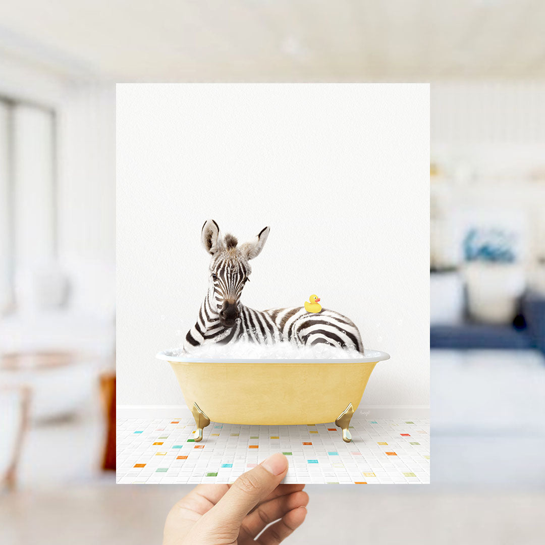 A zebra is sitting in a yellow bathtub, with a yellow rubber duck perched on its back.
