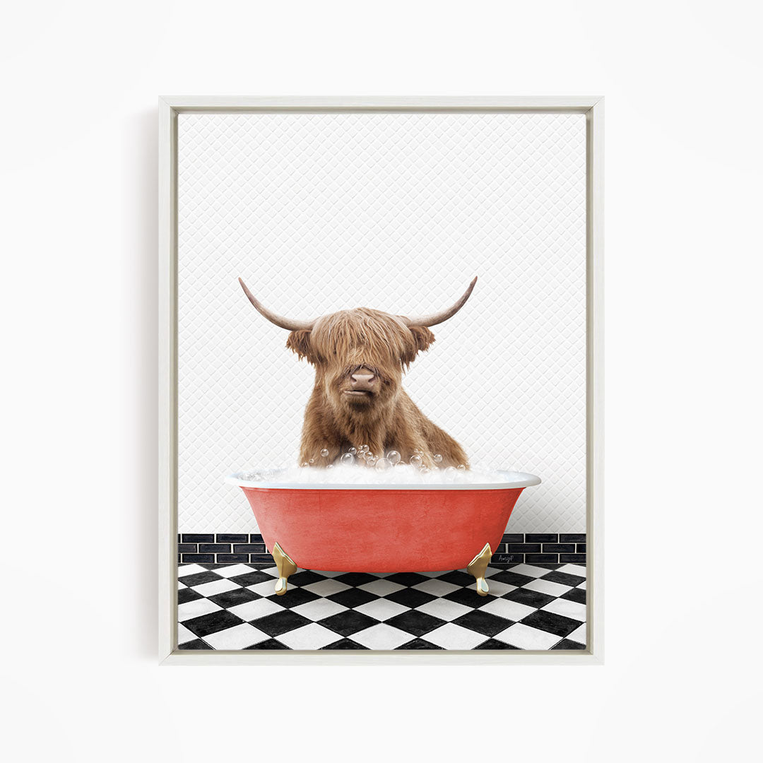 A brown cow with long horns is sitting in a red bathtub filled with water, creating a whimsical and playful scene.