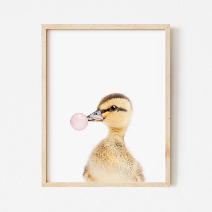 a picture of a duck with a bubble in its mouth