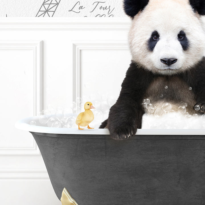 a panda bear sitting in a bathtub with a rubber duck