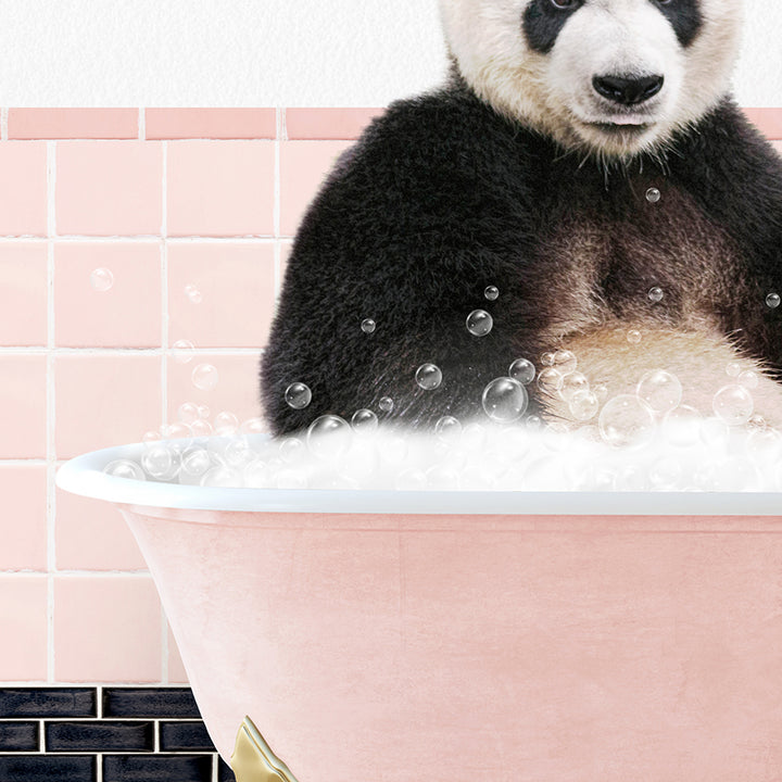 a panda bear sitting in a bathtub full of bubbles