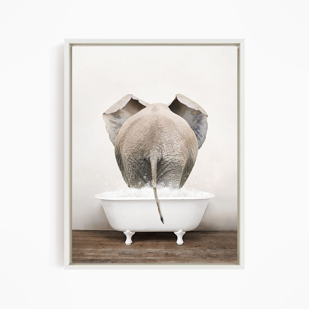 A gray elephant is standing in a white bathtub filled with water, with its back turned to the viewer.
