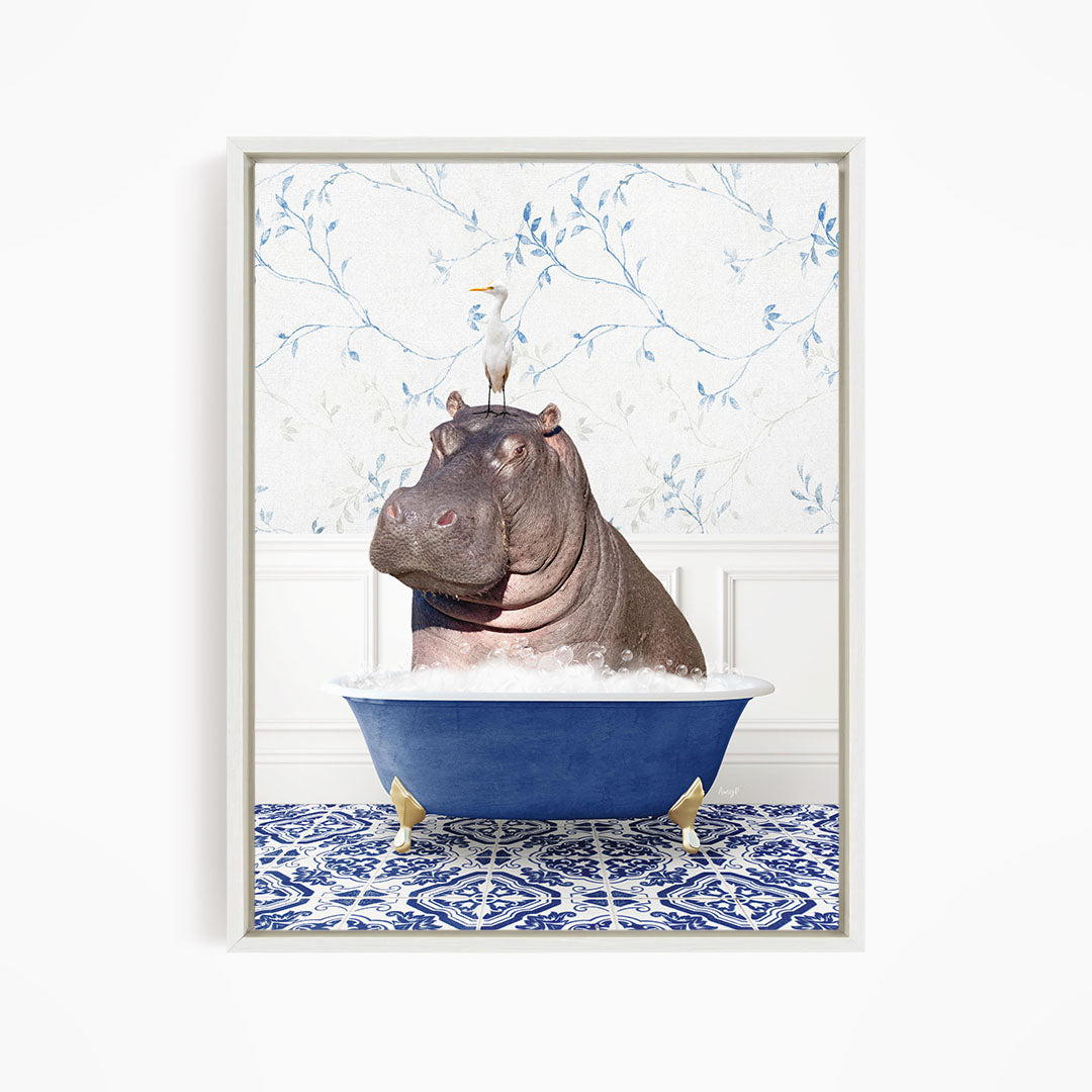A large hippopotamus sitting in a blue bathtub, with a white bird perched on its head.