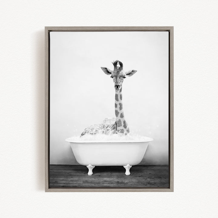 A giraffe sitting in a white bathtub filled with bubbles, creating a whimsical and playful scene.