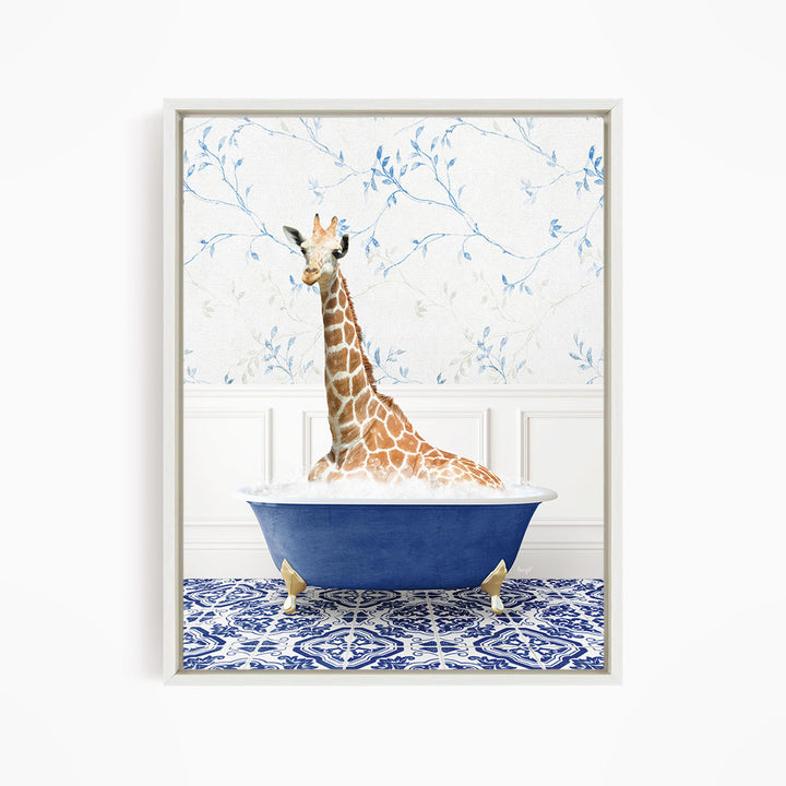 A giraffe sitting in a blue bathtub against a floral wallpaper background.